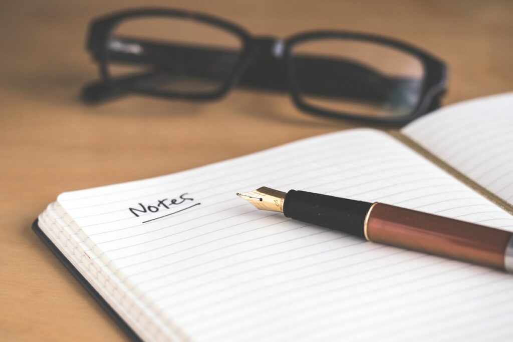 Notebook and writing materials on a desk
